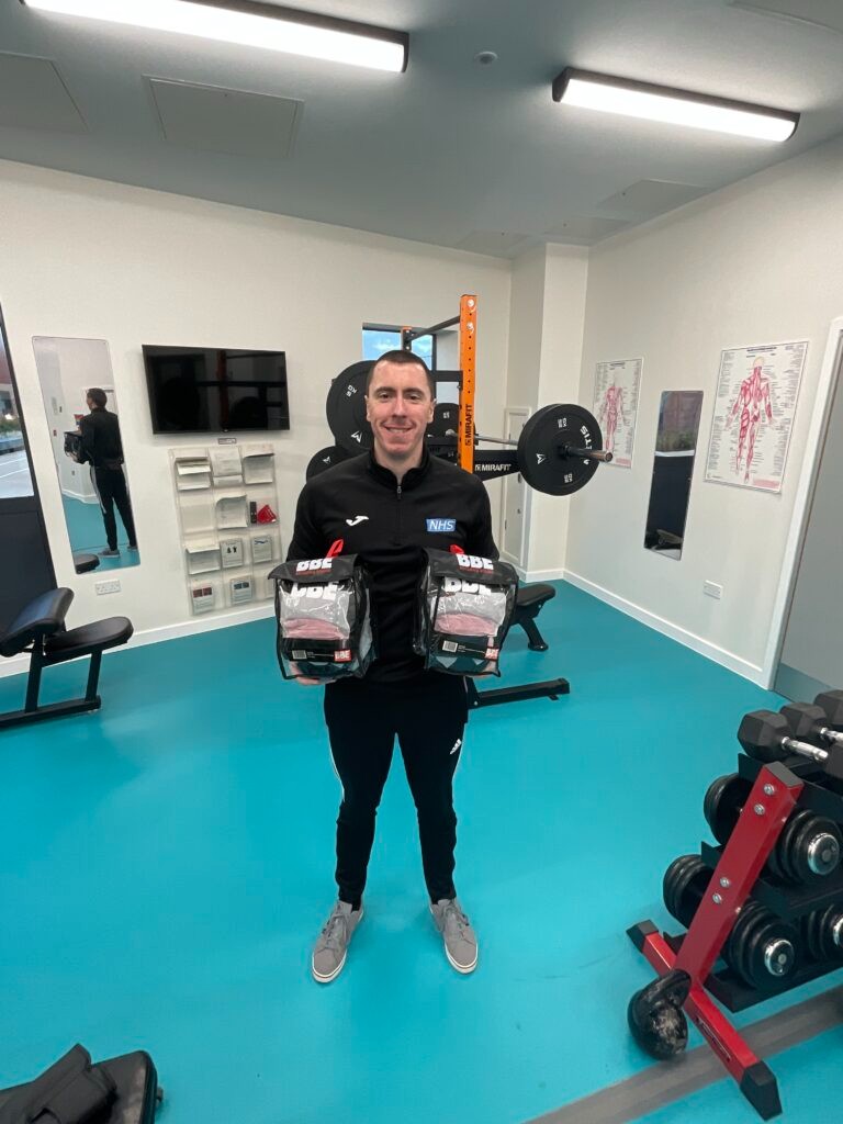 Man smiling in a gym room