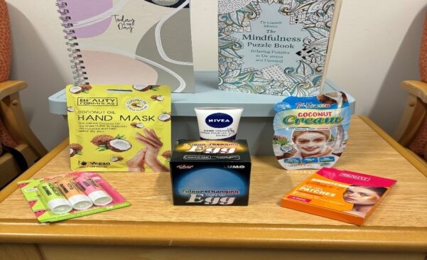 A table with self care items and mindfulness books